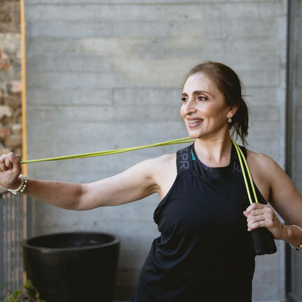 Person feeling energetic and happy after a light workout session.